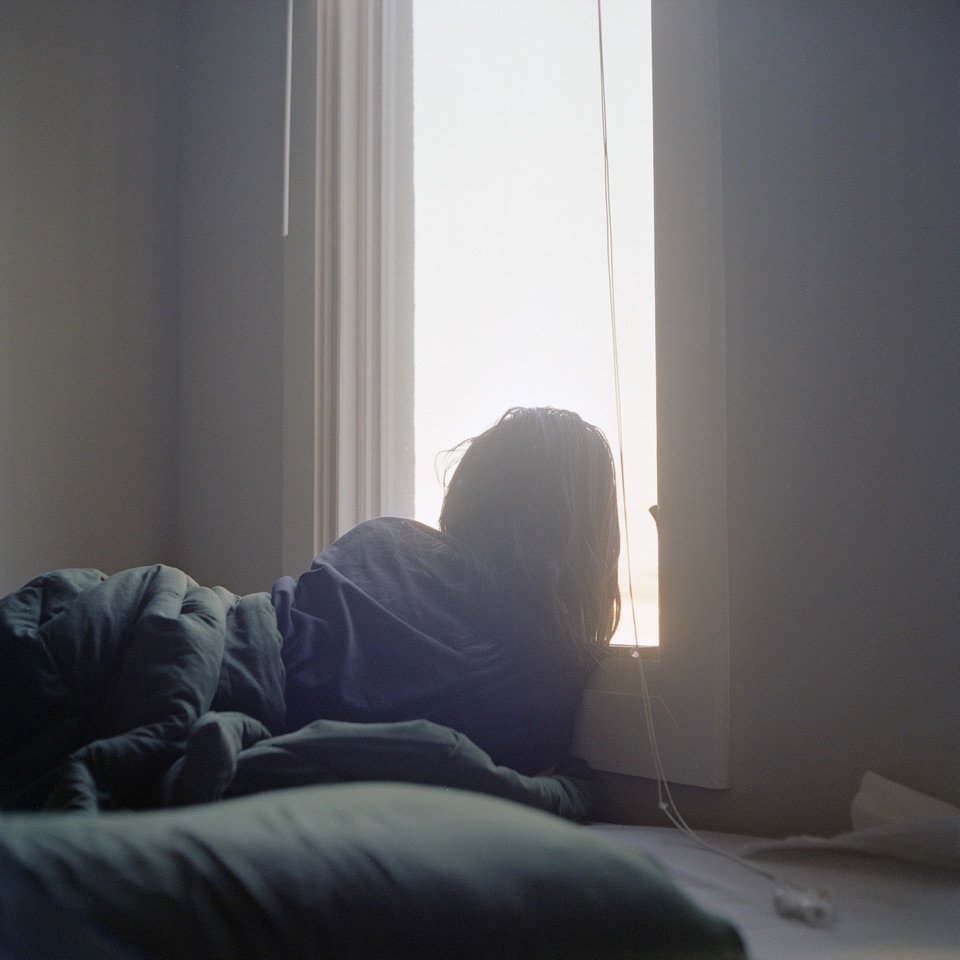 A woman looking out of a window